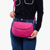 Royalty Large | Model wearing a leather Crossbody with a flap and magnetic closure
