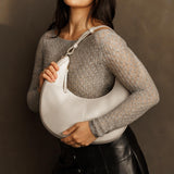 Bone Large | Crescent shaped shoulder bag with zipper closure and adjustable strap