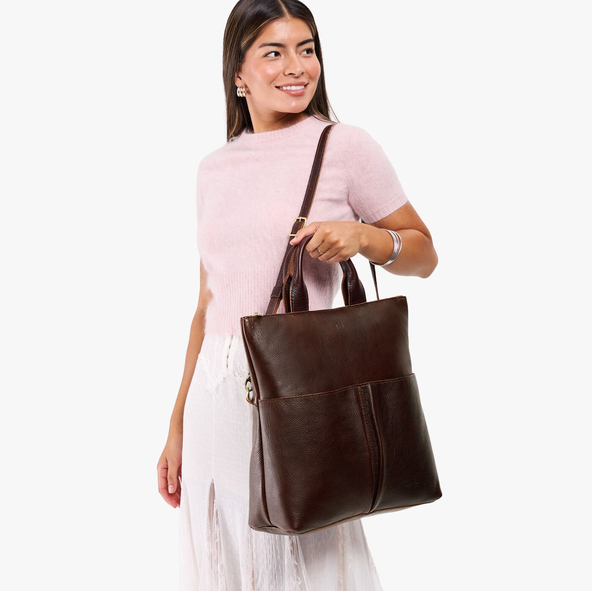 Coldbrew*Large | Model wearing a convertible tote clutch crossbody