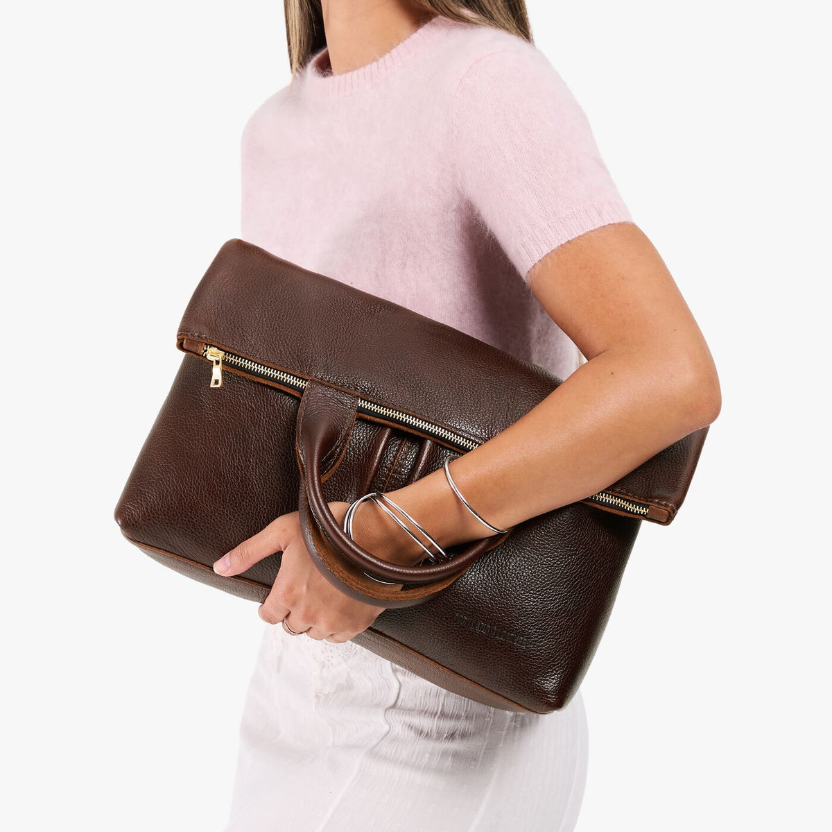 Coldbrew*Large | Model wearing a convertible tote clutch crossbody