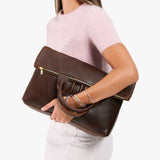 Coldbrew Large | Model wearing a convertible tote clutch crossbody