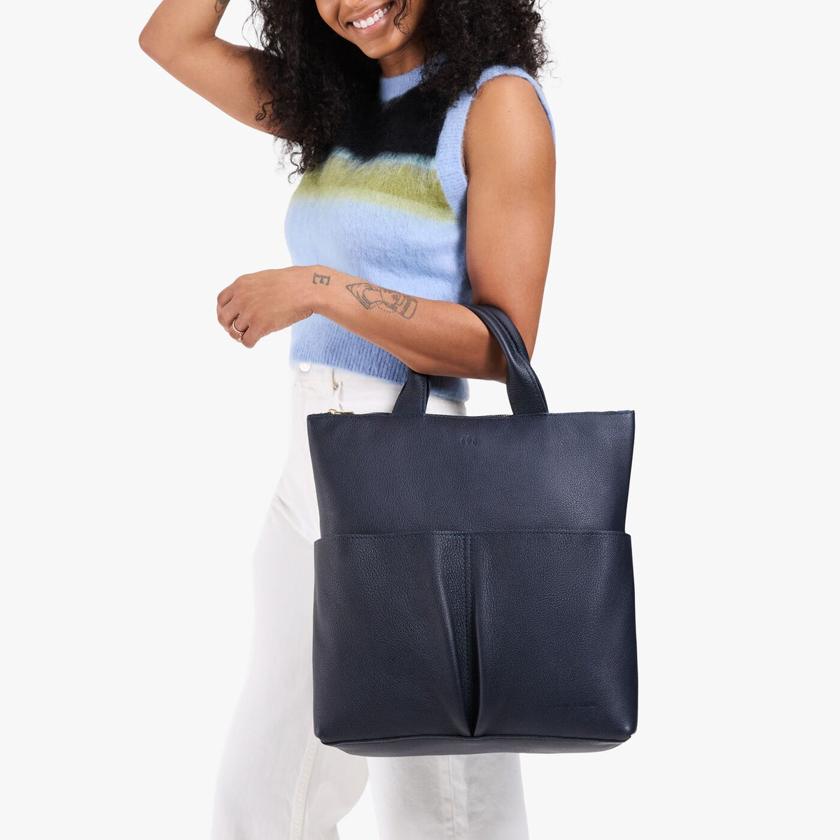 Night Owl*Large | Model wearing a convertible tote clutch crossbody