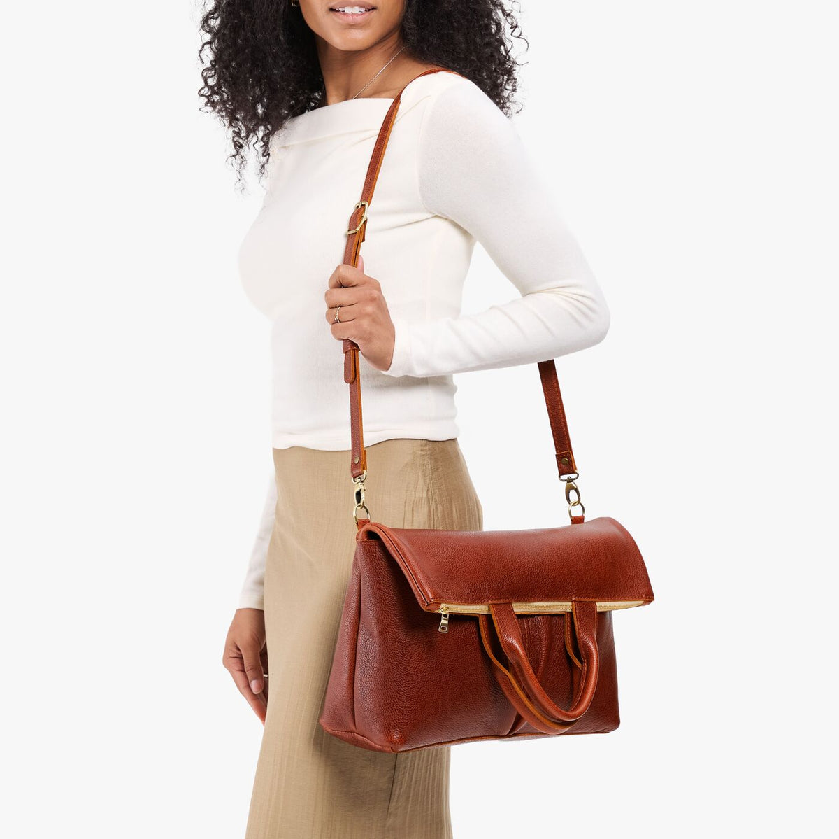 Nutmeg*Large | Model wearing a convertible tote clutch crossbody