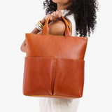 Sienna Large | Model wearing a convertible tote clutch crossbody