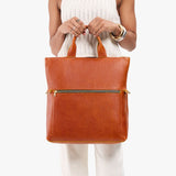 Sienna Large | Model wearing a convertible tote clutch crossbody