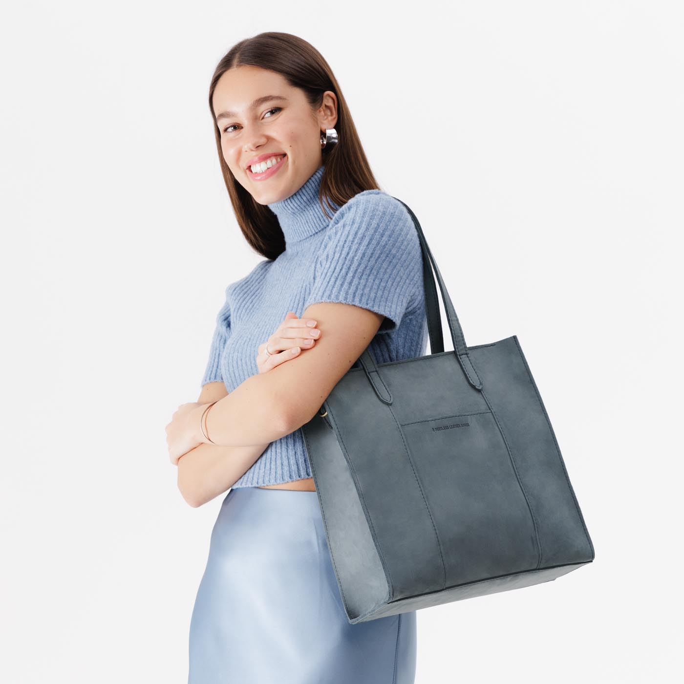 Storm*North/South | Structured large tote bag with overlapping panels and crossbody strap
