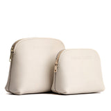 Bone | Comparison view of compact leather pouches with top zippers