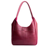 Orchid Large | U-shaped, flat-bottomed leather shoulder bag with two outside pockets