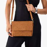 Desert Flower | Model wearing leather Crossbody Bag with Magnetic Messenger Bag Closure