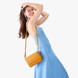 Sunshine Medium | Model Wearing Small Leather Crossbody Bag with Magnetic Messenger Bag Closure