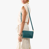 Sea Glass Mini | Model Wearing Small Leather Crossbody Bag with Magnetic Messenger Bag Closure