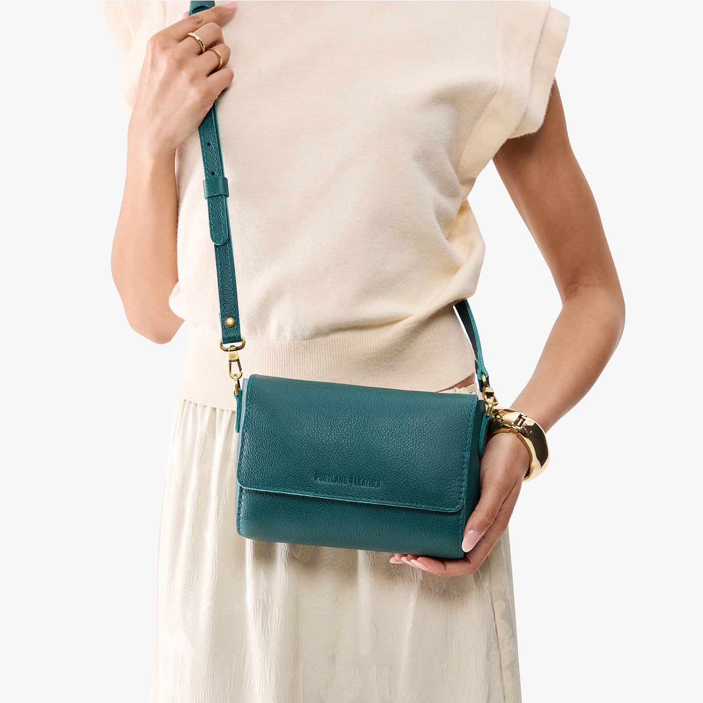 Sea Glass*Mini | Model holding Small Leather Crossbody Bag with Magnetic Messenger Bag Closure
