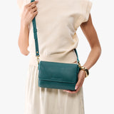 Sea Glass Mini | Model holding Small Leather Crossbody Bag with Magnetic Messenger Bag Closure