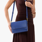 Molino Blue Medium | Model Holding Leather Crossbody Bag with Magnetic Messenger Bag Closure