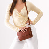 Nutmeg Medium | Model Wearing Leather Crossbody Bag with Magnetic Messenger Bag Closure