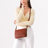 Nutmeg Medium | Model Wearing Leather Crossbody Bag with Magnetic Messenger Bag Closure