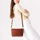 Nutmeg Medium | Model Wearing Leather Crossbody Bag with Magnetic Messenger Bag Closure