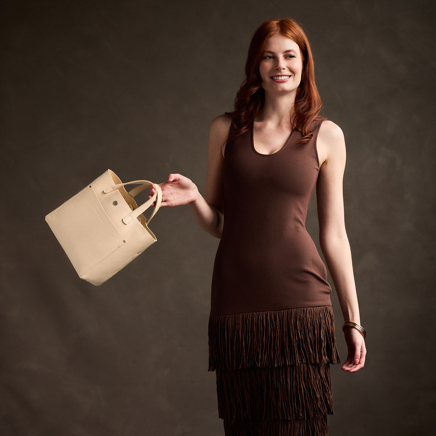 Pebbled Bone*Classic | Model carrying crossbody tote bag with snap closure and front pocket