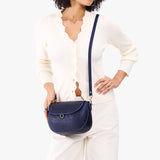 Cobalt Large | Model wearing a leather Crossbody with a flap and magnetic closure
