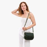 Evergreen Large | Model wearing a leather Crossbody with a flap and magnetic closure