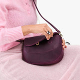 Larkspur Large | Model wearing a leather Crossbody with a flap and magnetic closure
