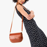 Madrone Large | Model wearing a leather Crossbody with a flap and magnetic closure