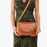 Sienna Large | Model wearing a leather Crossbody with a flap and magnetic closure