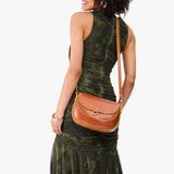 Sienna Large | Model wearing a leather Crossbody with a flap and magnetic closure