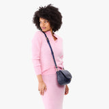 Cobalt Small | Model wearing a petite leather Crossbody with a flap and magnetic closure