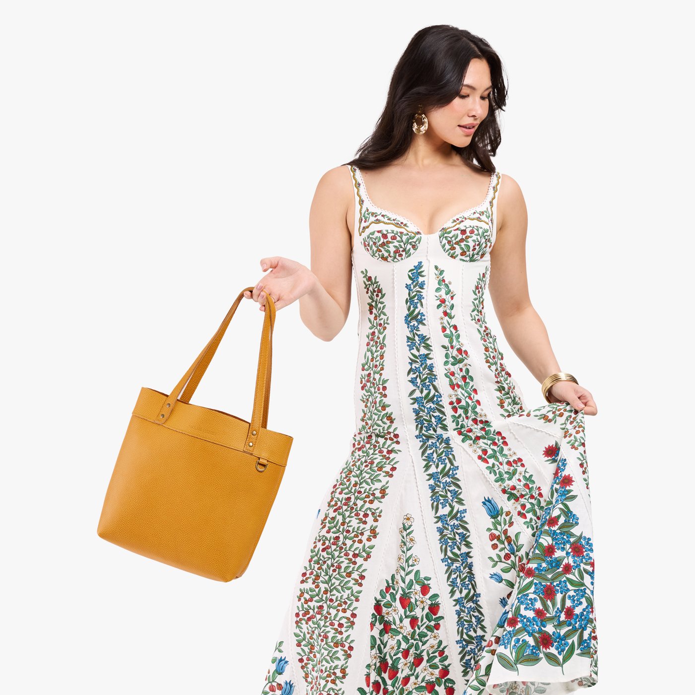 Sunshine*Medium*Classic| Model wearing leather tote bag with riveted straps and exterior key loop