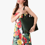 Evergreen Medium Zipper | Model wearing leather tote bag with riveted straps and exterior key loop
