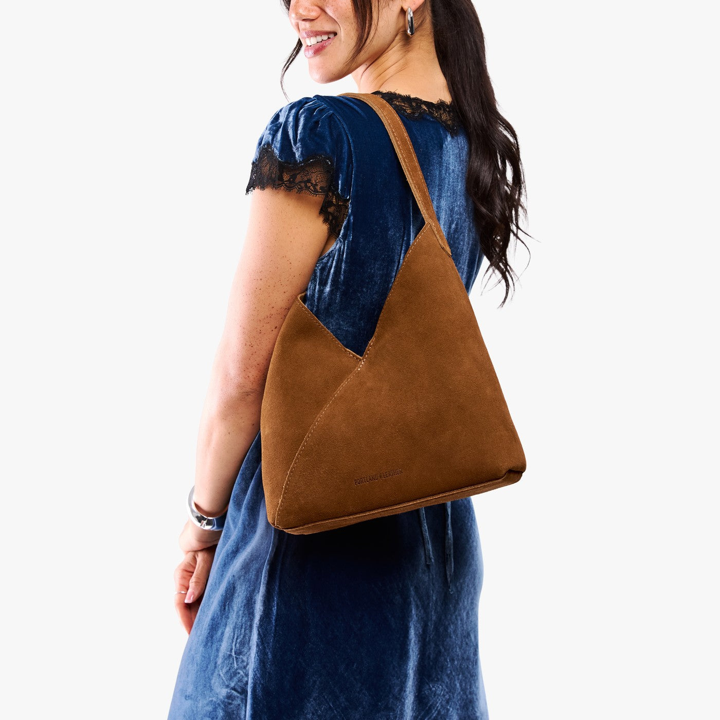 Jackson*Large | Model wearing mid-size shoulder bag with magnetic snap closure