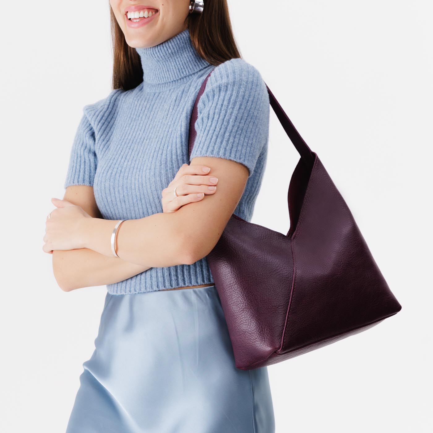 Plum*Large | Model wearing mid-size shoulder bag with magnetic snap 