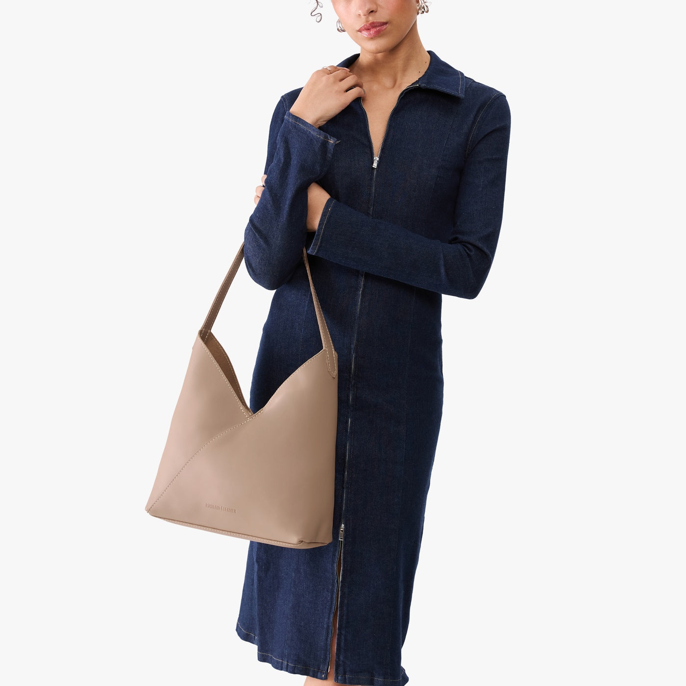 Stone*Large | Model wearing mid-size shoulder bag with magnetic snap 