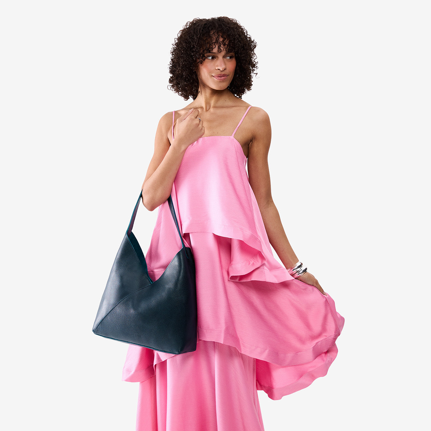Boreal*Oversized | Model wearing large shoulder bag with adjustable strap and magnetic snap closure