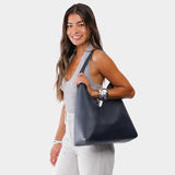 Night Owl Oversized | Model wearing large shoulder bag with adjustable strap and magnetic snap closure