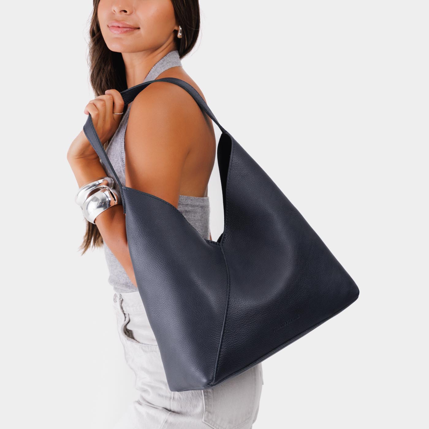 Night Owl*Oversized | Model wearing large shoulder bag with adjustable strap and magnetic snap closure