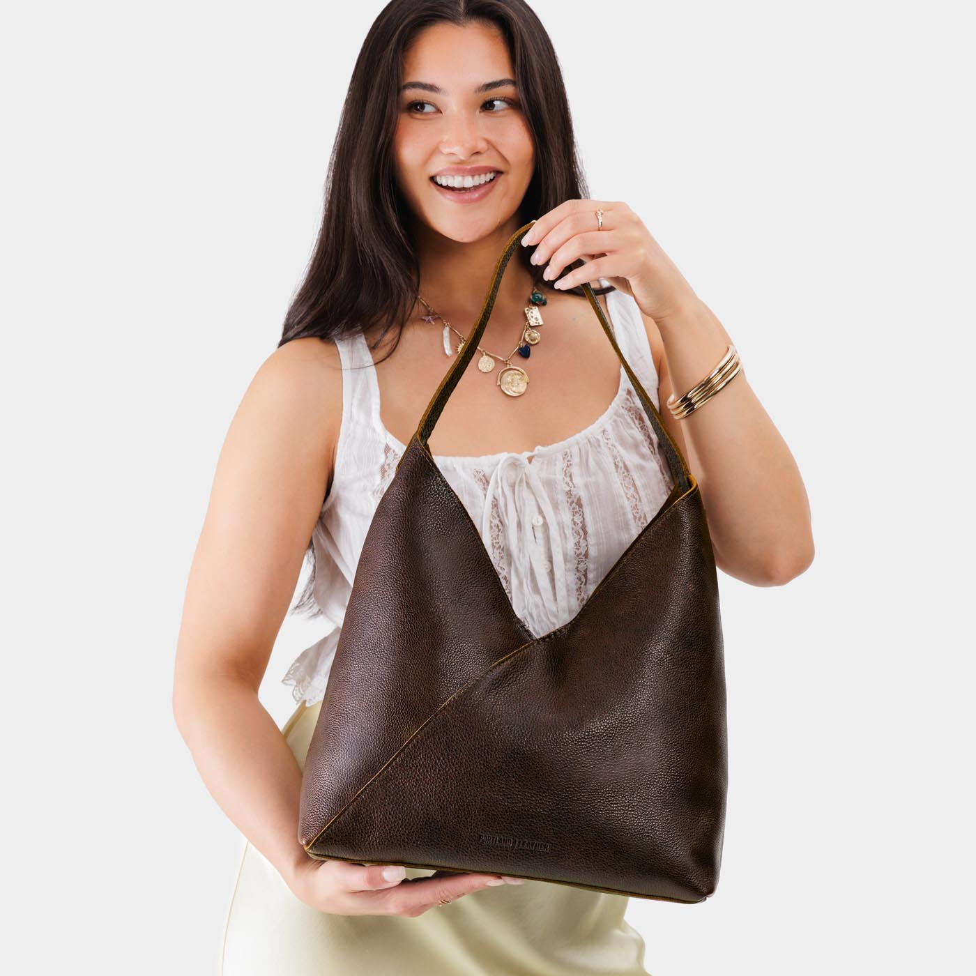 Coldbrew*Oversized | Model wearing large shoulder bag with magnetic snap closure