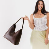 Coldbrew Oversized | Model wearing large shoulder bag with magnetic snap closure