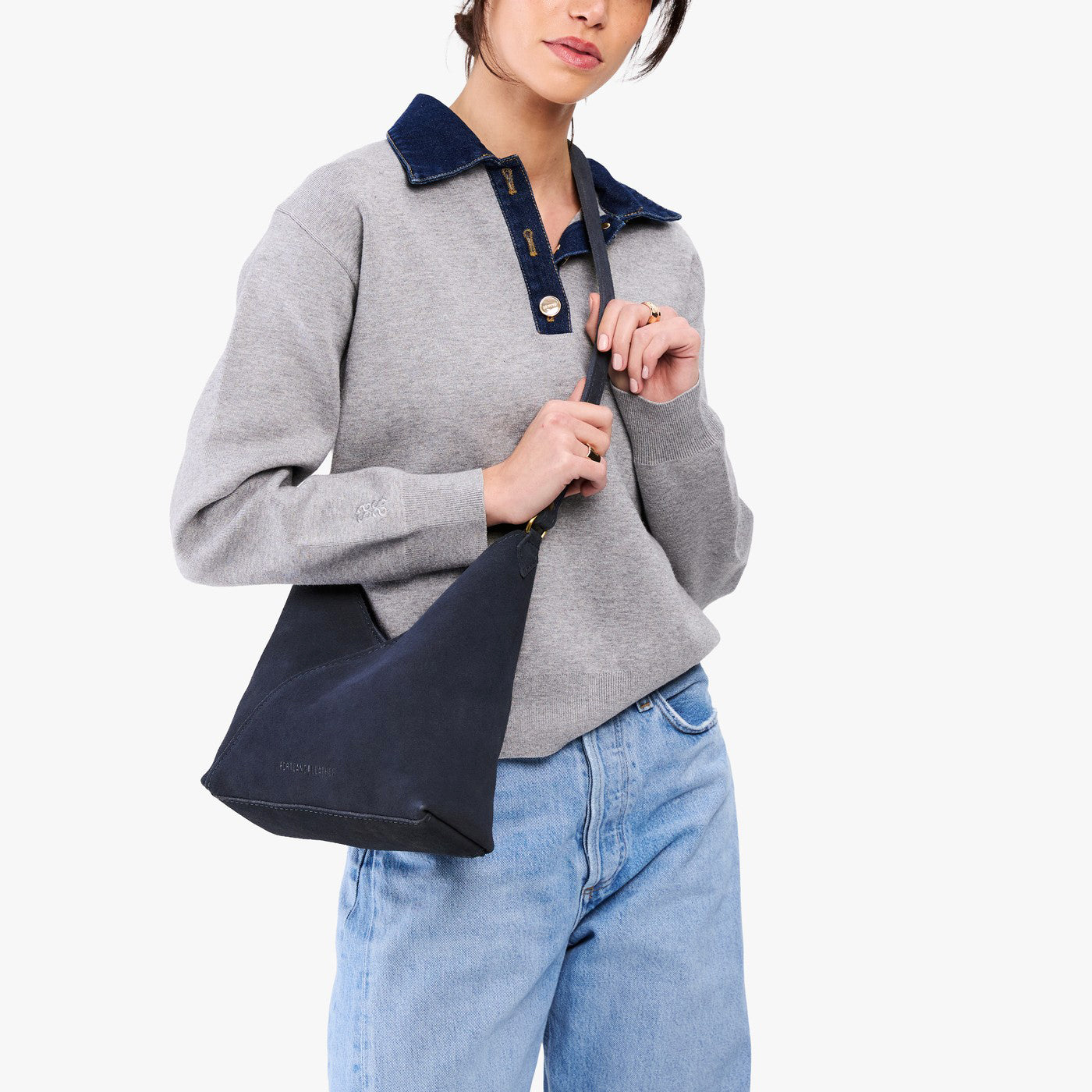 Alaska Blue*Small | Model wearing petite shoulder bag with adjustable strap and magnetic snap closure