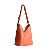 Koi Small | Petite shoulder bag with adjustable strap and magnetic snap closure