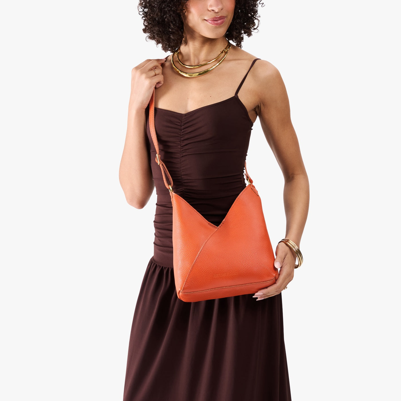 Koi*Small | Model wearing petite shoulder bag with adjustable strap and magnetic snap closure