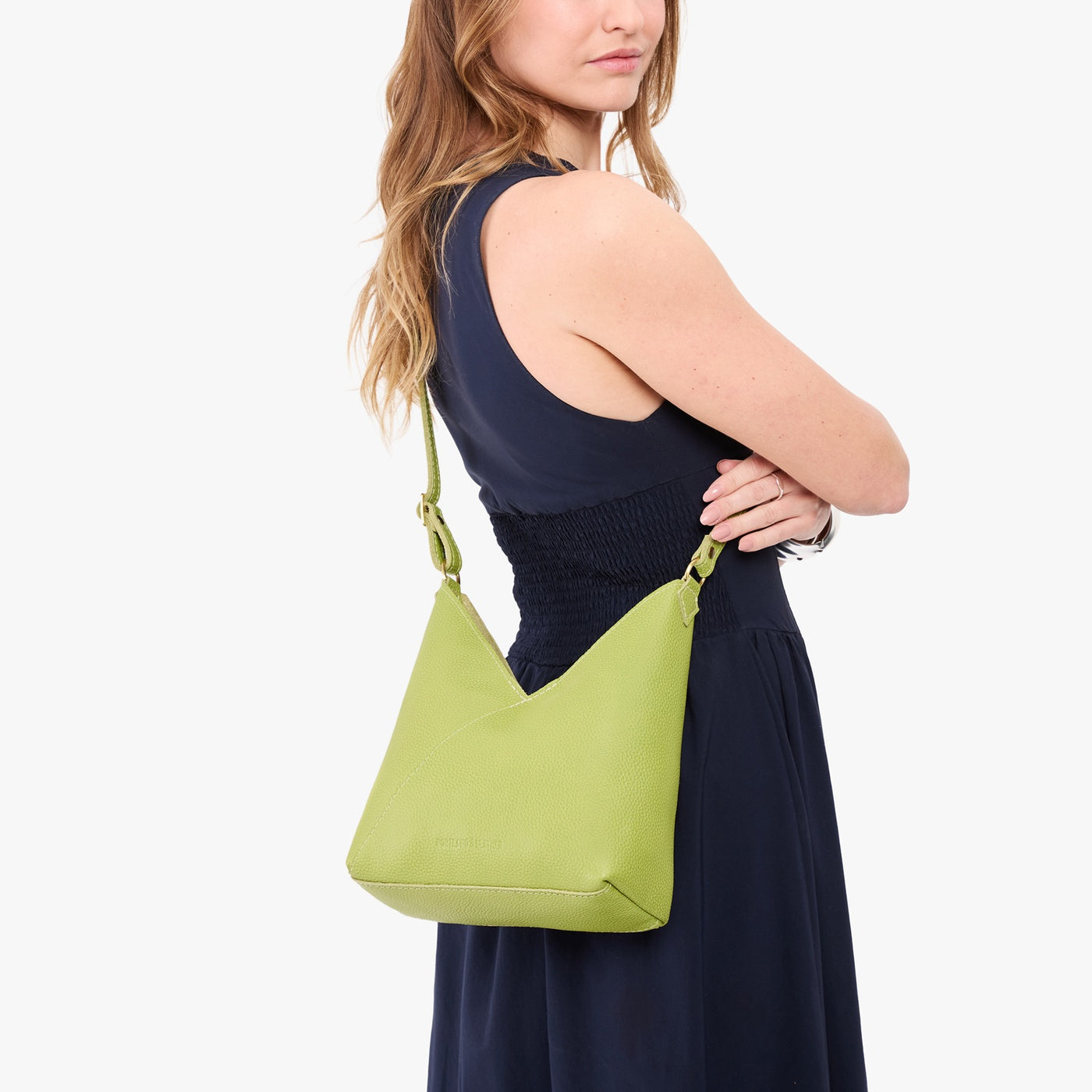Wasabi*Small | Model wearing petite shoulder bag with adjustable strap and magnetic snap closure