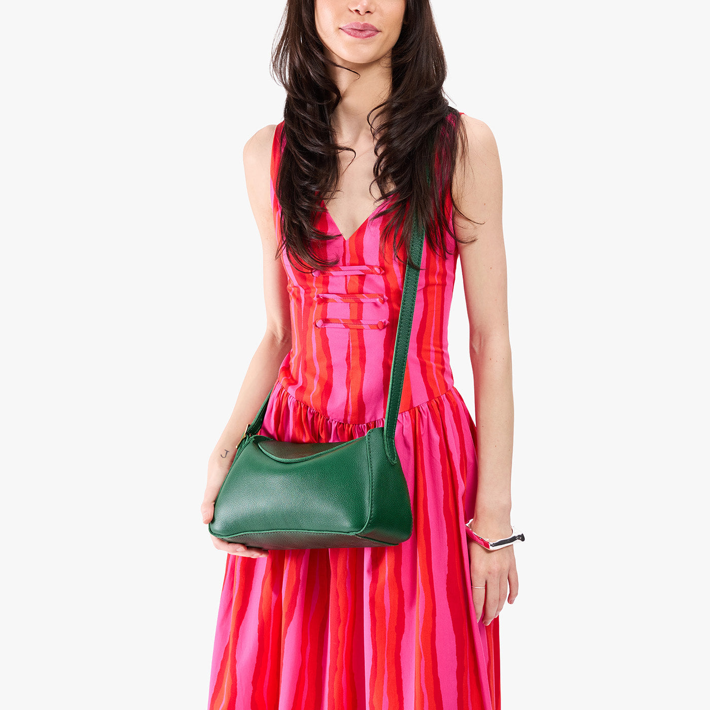 Bacalar*Small | Model wearing a leather Crossbody with a flap and magnetic closure