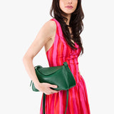 Bacalar Small | Model wearing a leather Crossbody with a flap and magnetic closure