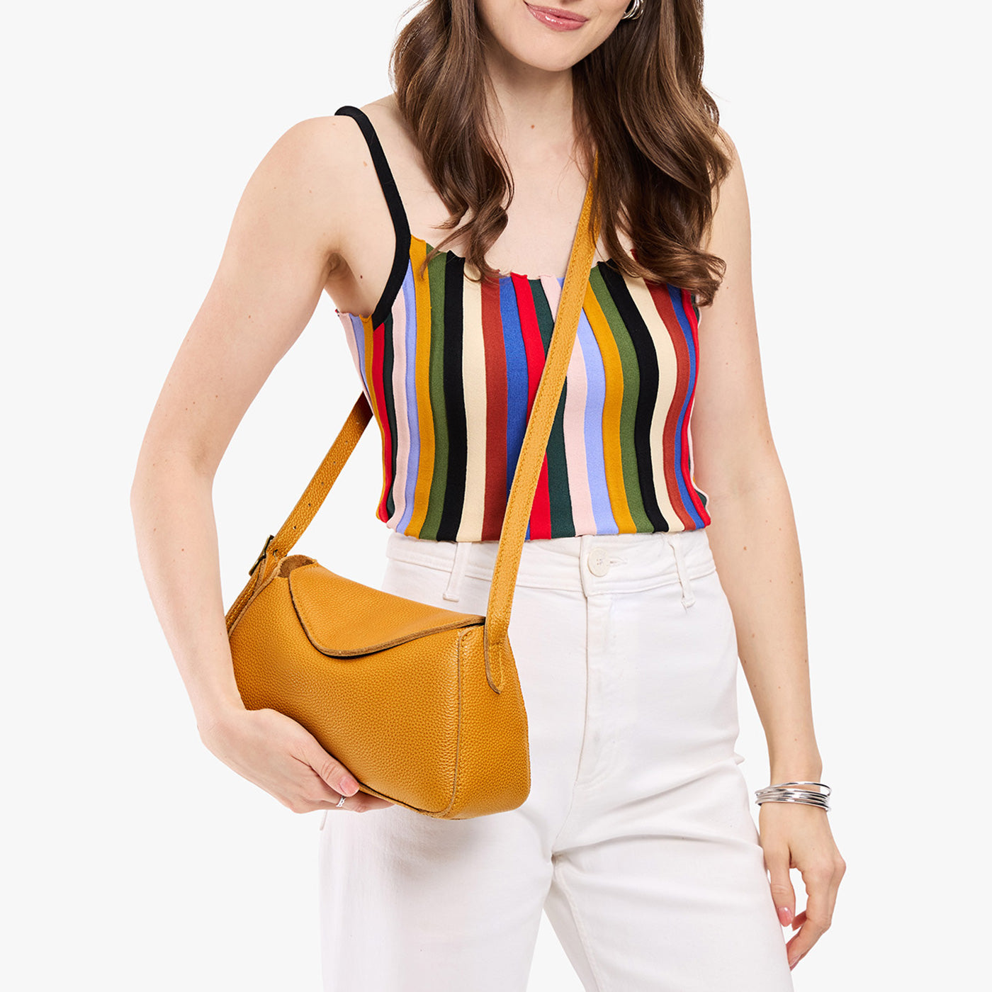 Sunshine*Small | Model wearing a leather Crossbody with a flap and magnetic closure