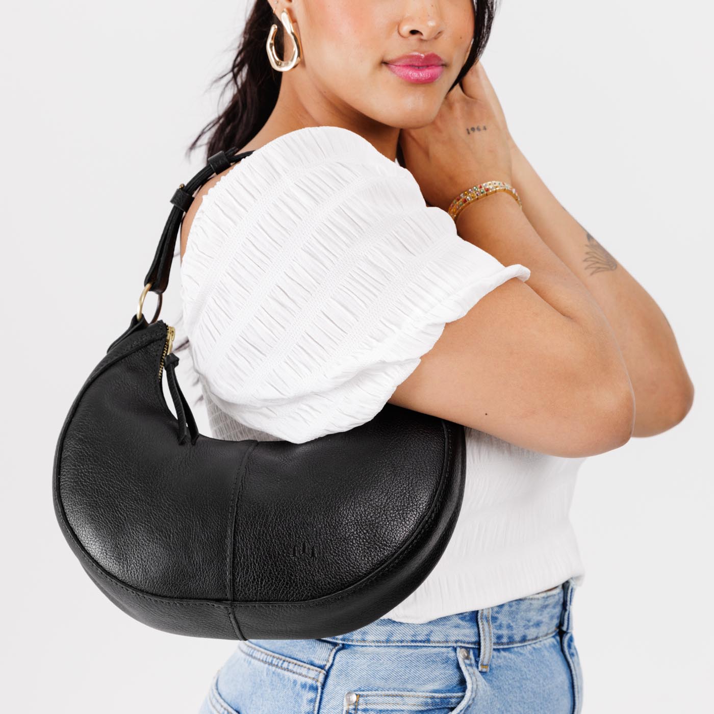 Pebbled--black*Classic | Crescent shaped shoulder bag with zipper closure and adjustable strap