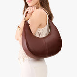 Cognac Large | Crescent shaped shoulder bag with zipper closure and adjustable strap