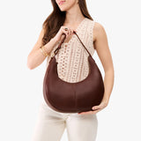 Cognac Large | Crescent shaped shoulder bag with zipper closure and adjustable strap