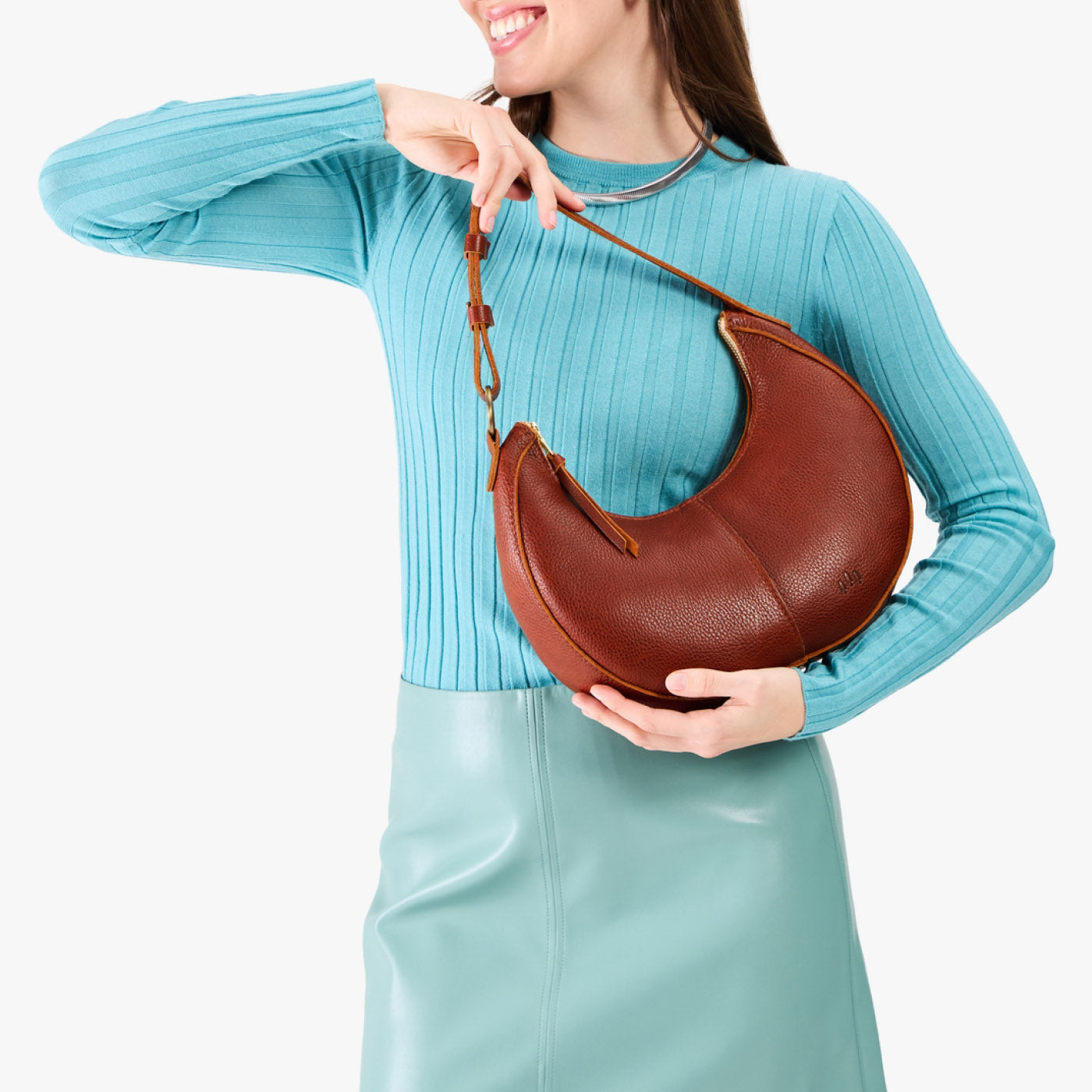 Nutmeg*Classic | Crescent shaped shoulder bag with zipper closure and adjustable strap
